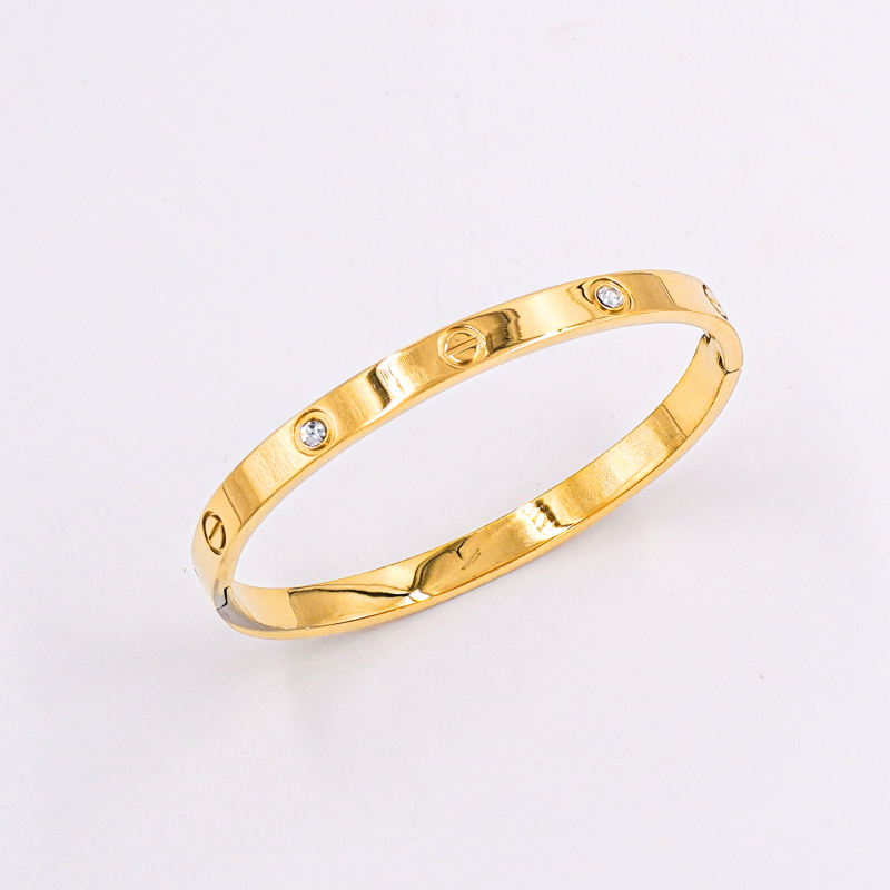 BRAZALETE CLAVO DORADO CON...