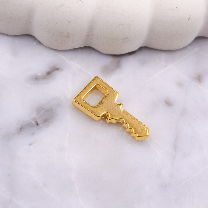 DIJE DE LLAVE DORADO X UNIDAD