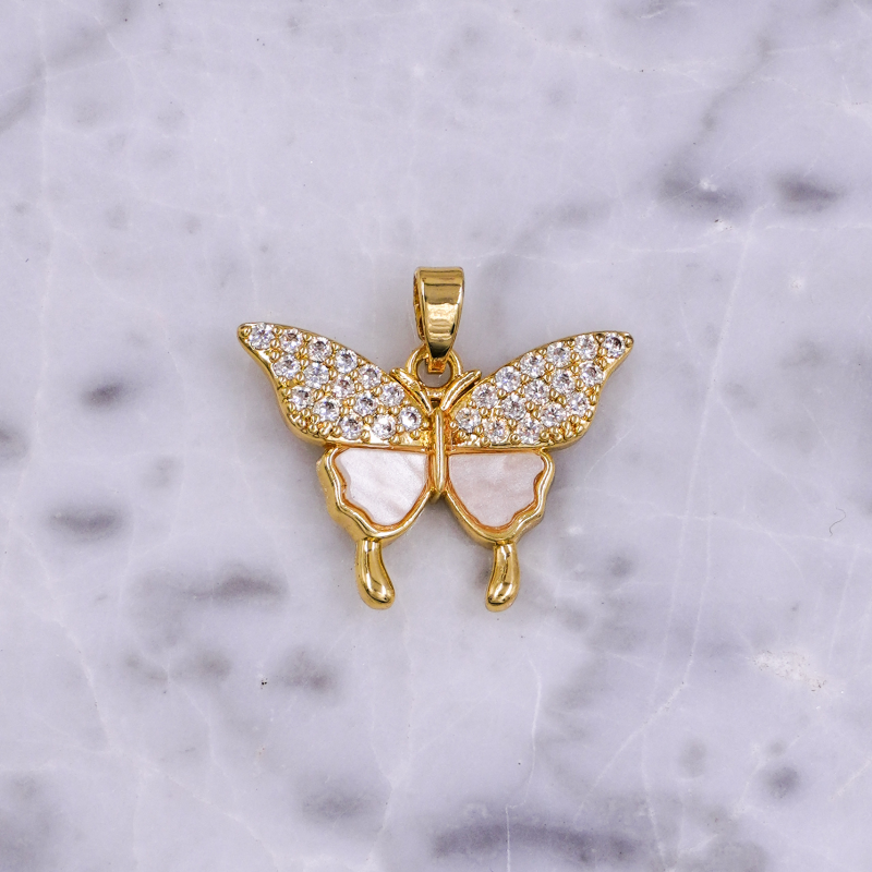 dije de mariposa con nacar...