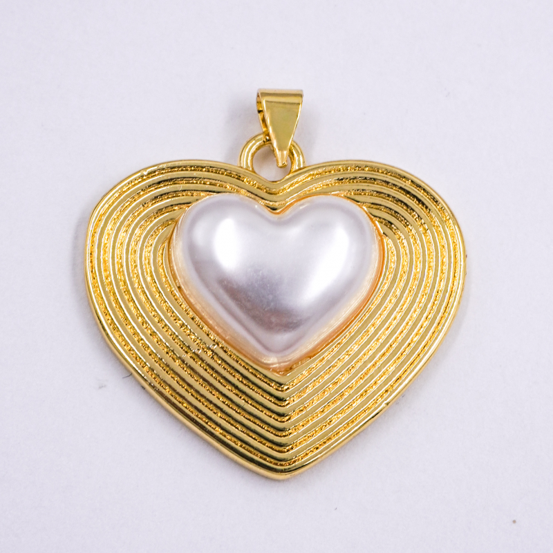 dije de corazon con perla