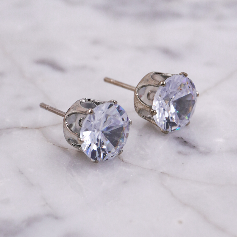 Aretes topo plateado...