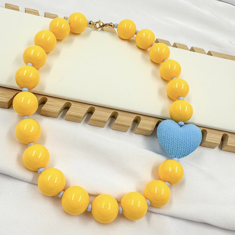 collar bola chiche amarillo...