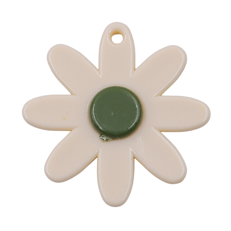 Dije flor beige con punto...