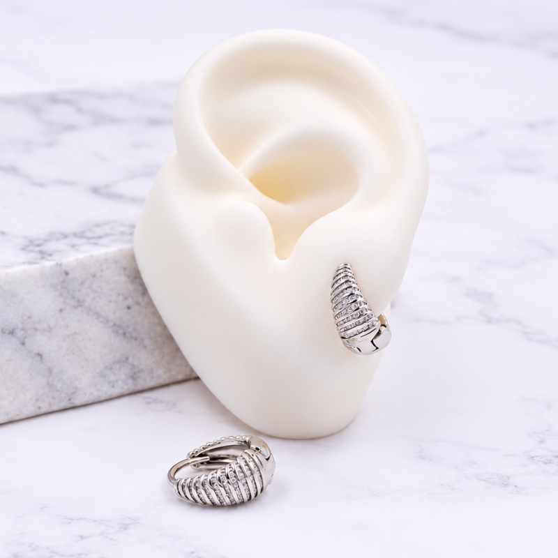 Aretes candonga plateada en...